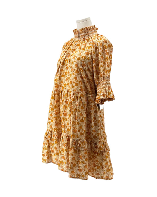 Floral dress on a mannequin against a white background