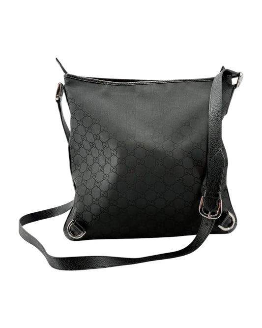 Black leather handbag with a pattern on a white background