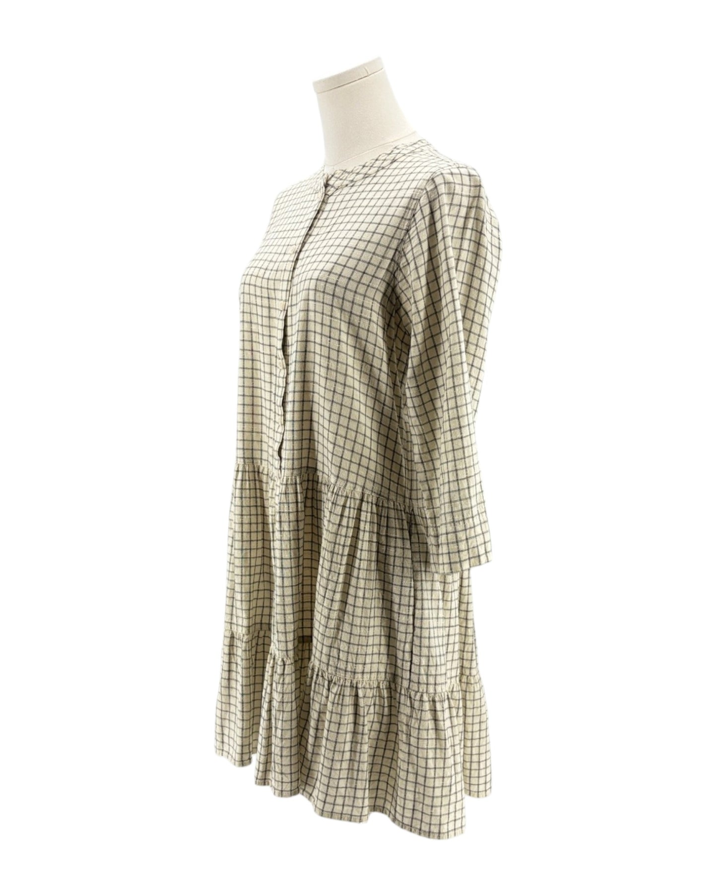 Checkered dress on a mannequin against a white background