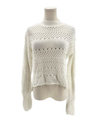 White knitted sweater on a mannequin against a white background
