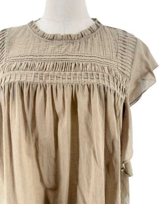 Beige short sleeve top with smocked yoke bodice, ruffled crewneck, tiered bohemian flutter sleeves on a mannequin on a white background