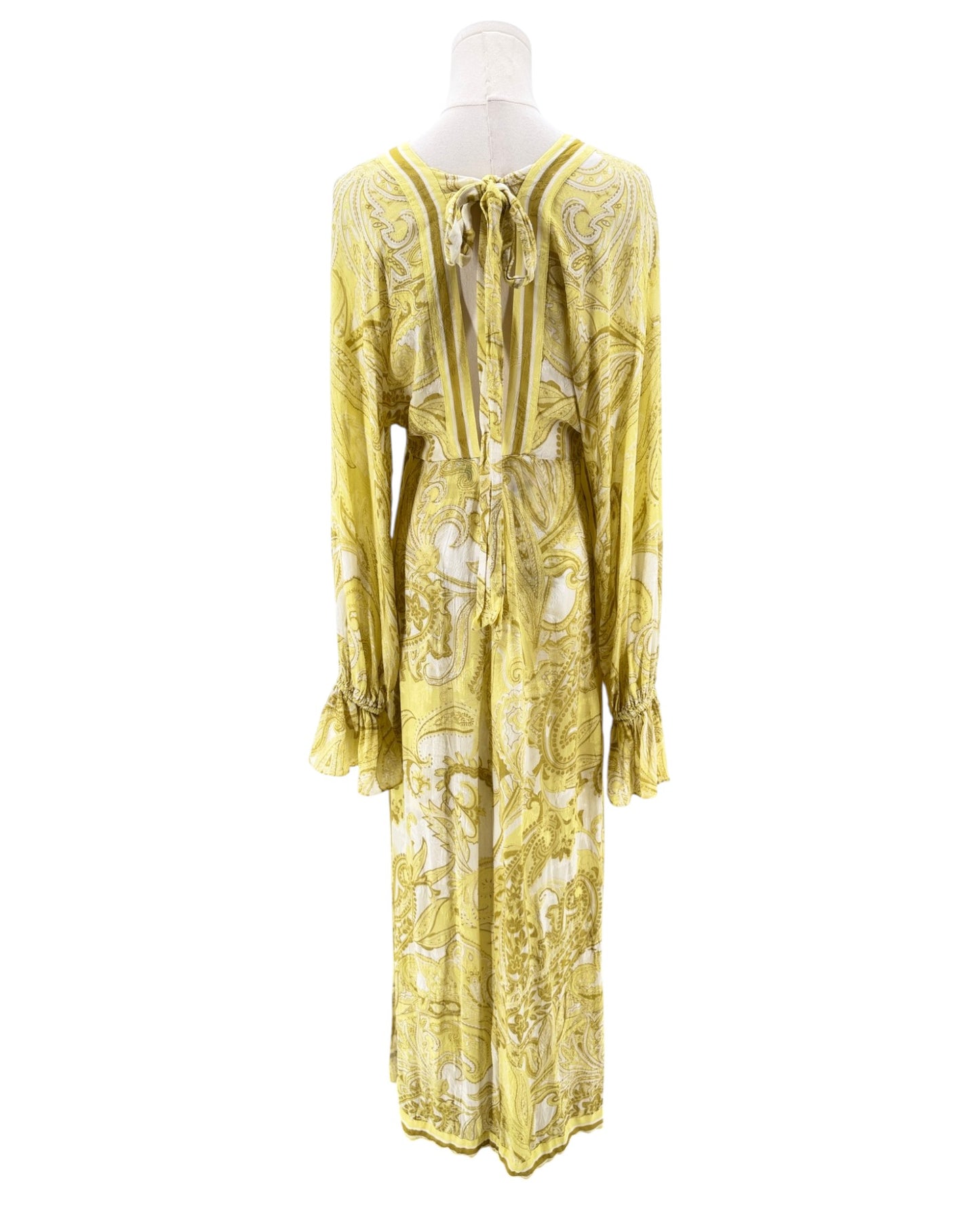 Yellow floral dress on a mannequin against a white background
