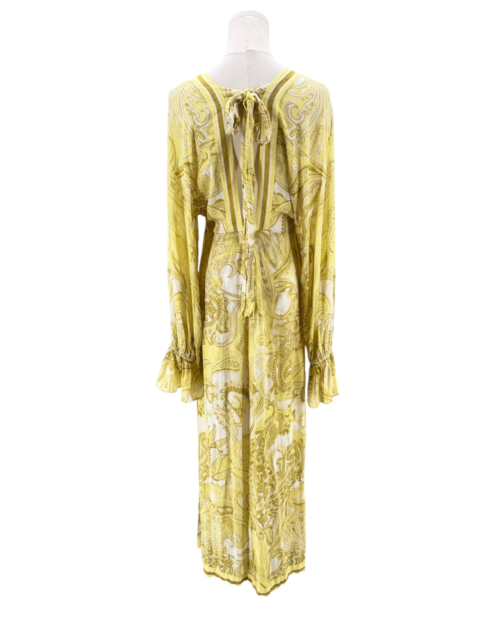 Yellow floral dress on a mannequin against a white background