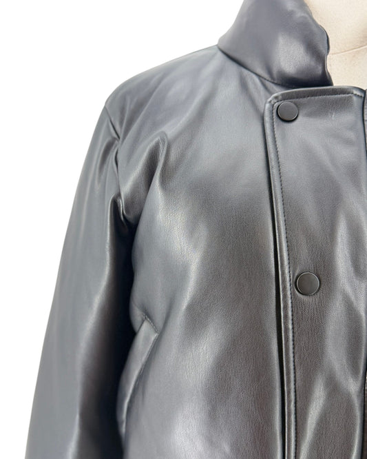 Close-up of a dark gray leather jacket on a mannequin, showing the collar, buttoned front closure, and smooth leather texture against a plain white background.