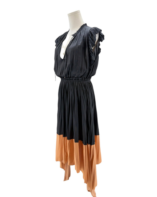 Black and orange dress on a mannequin against a white background