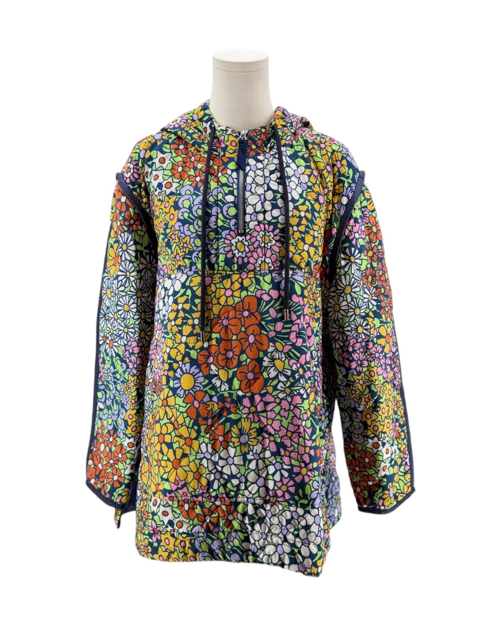 Colorful floral-patterned shirt on a mannequin against a white background