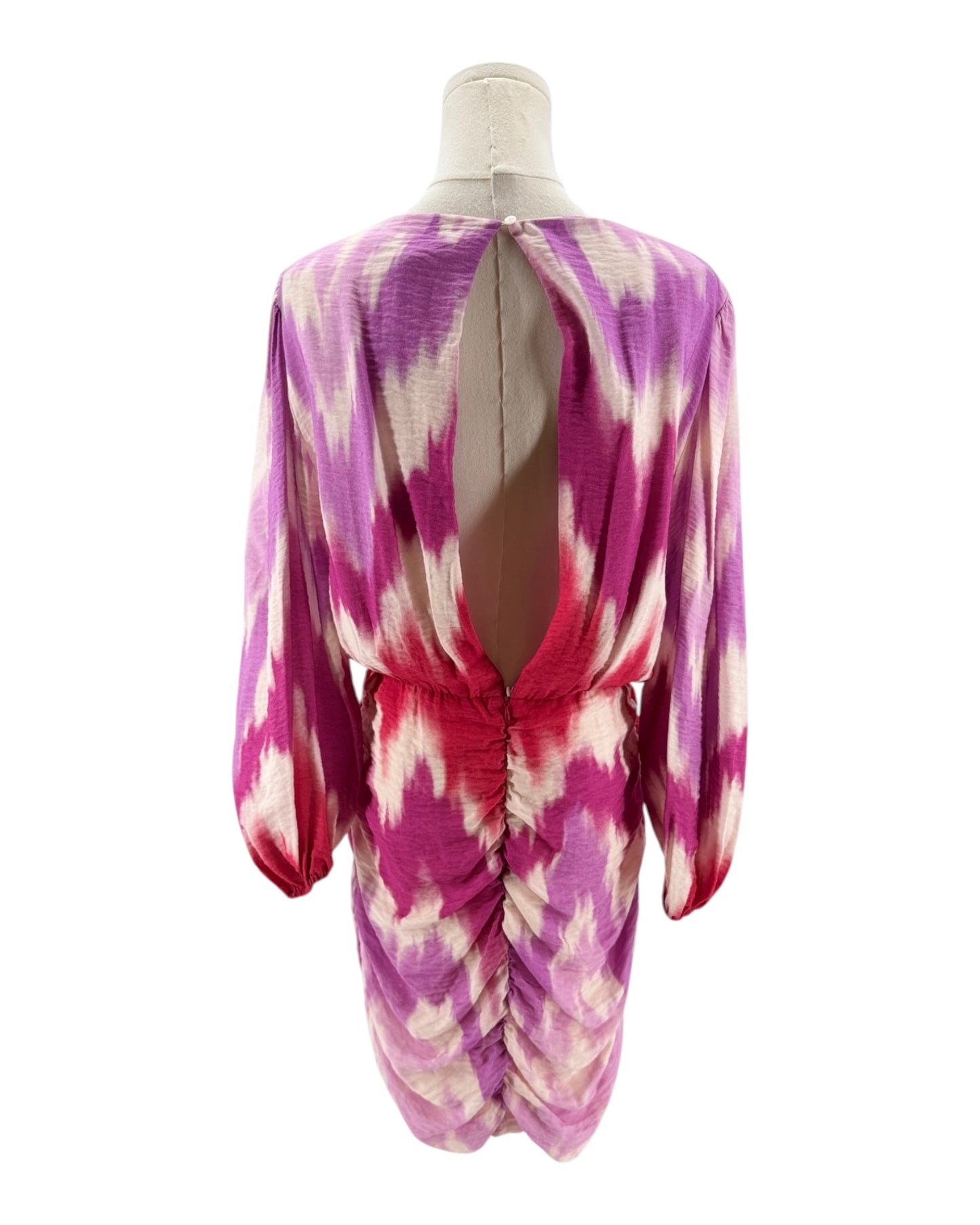 Mannequin wearing a pink and purple tie-dye dress on a white background