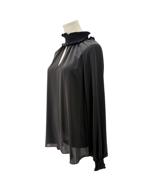 A black draped cape-style blouse with a ruffled mock neck and long sleeves, displayed on a mannequin torso against a plain white background.