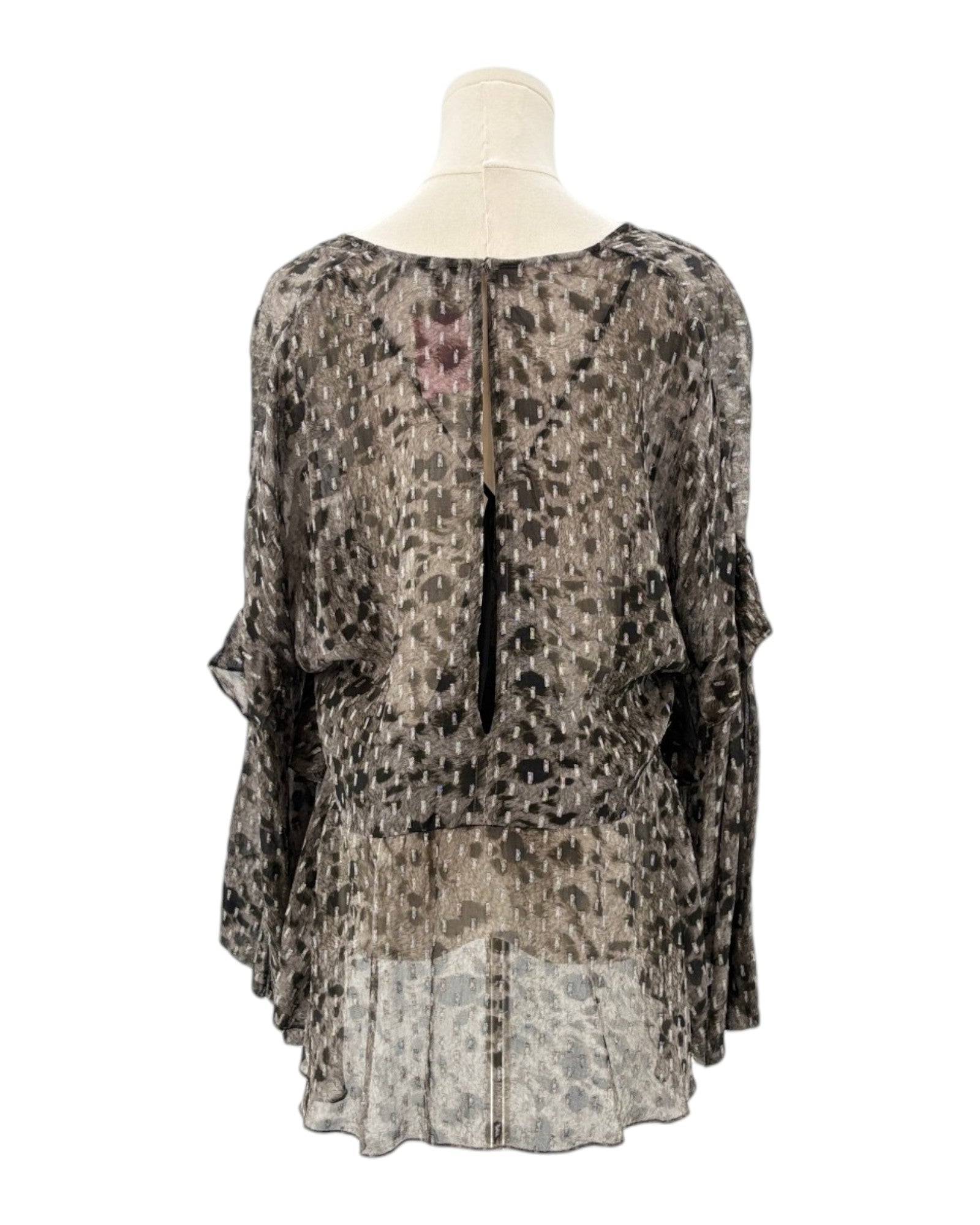 IRO sheer patterned blouse on a mannequin against a white background