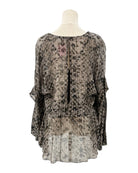 IRO sheer patterned blouse on a mannequin against a white background