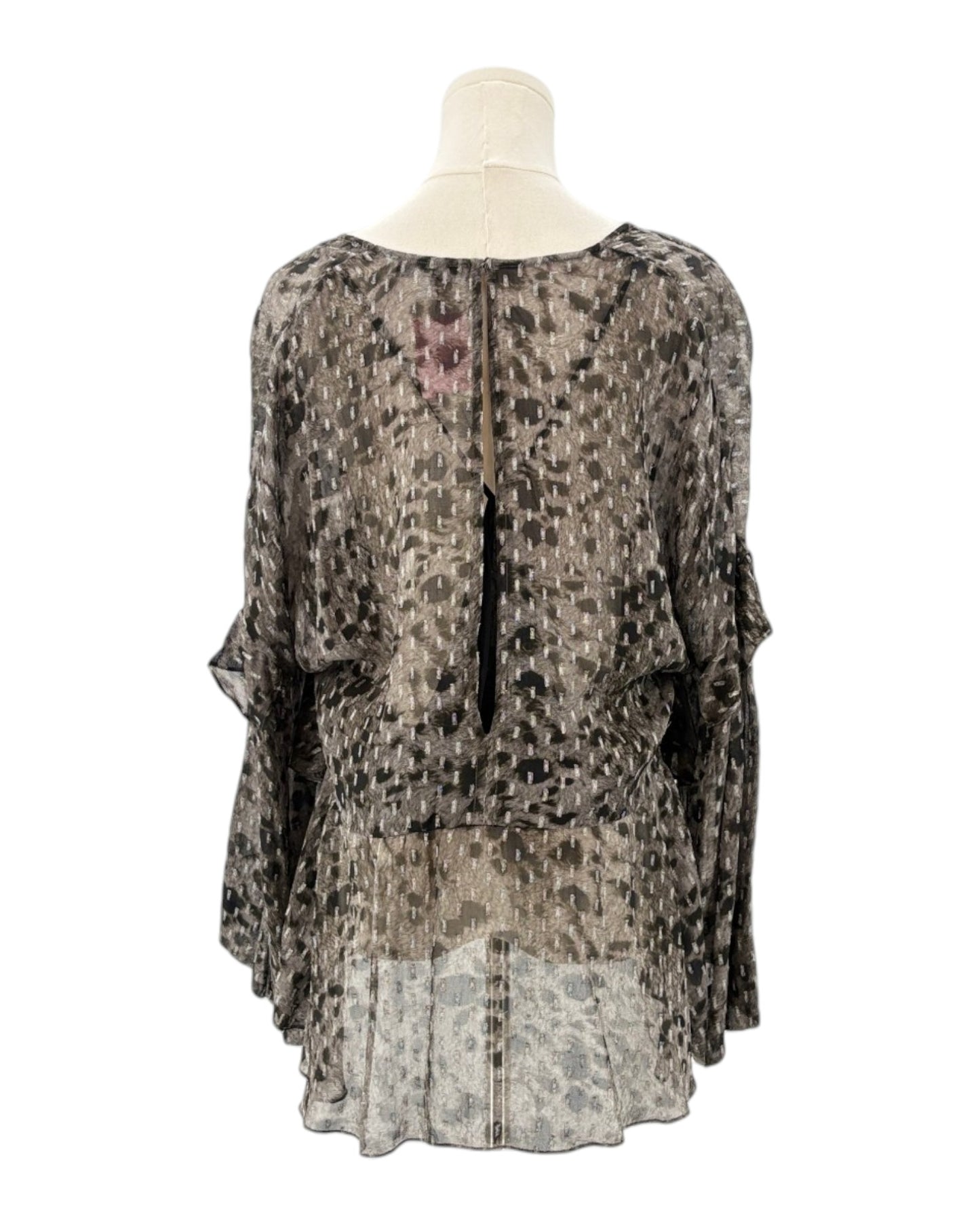 IRO sheer patterned blouse on a mannequin against a white background