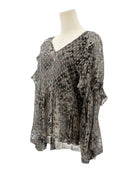 IRO sheer patterned blouse on a mannequin against a white background