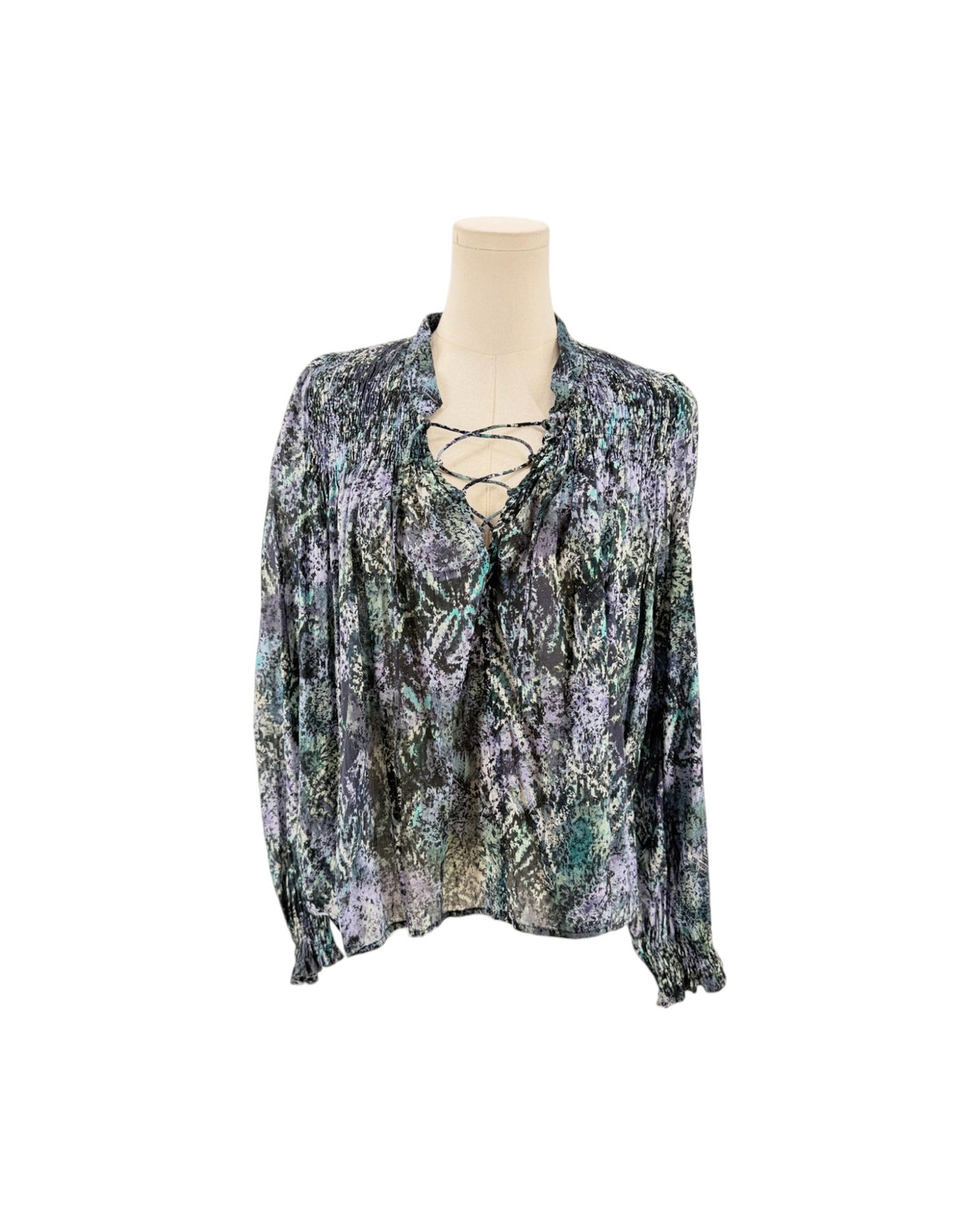 Long sleeve multicolor blouse on a mannequin on a white background