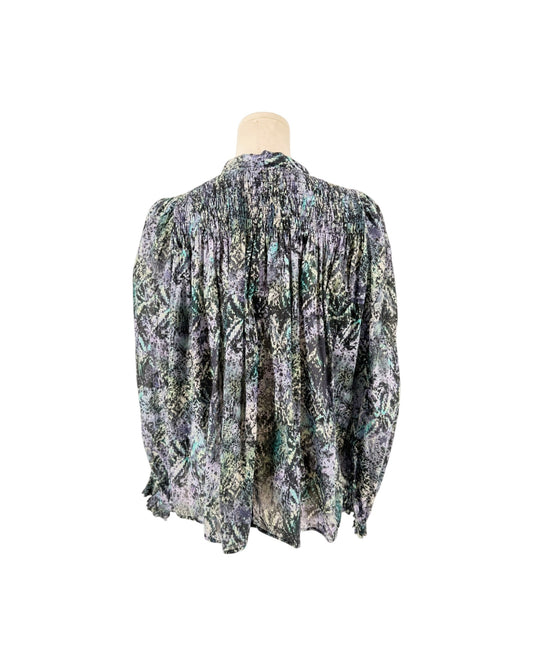 Long sleeve multicolor blouse on a mannequin on a white background