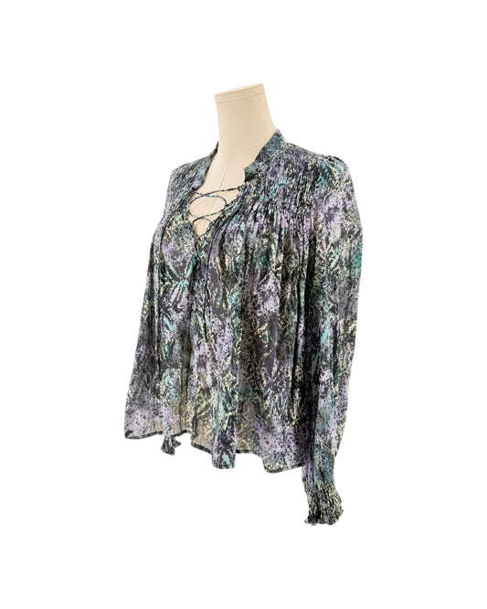 Long sleeve multicolor blouse on a mannequin on a white background