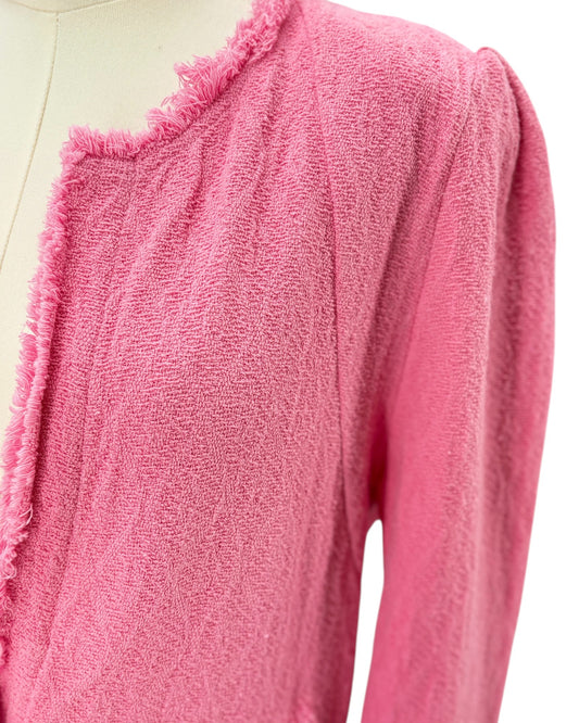 Pink textured jacket on a mannequin against a white background
