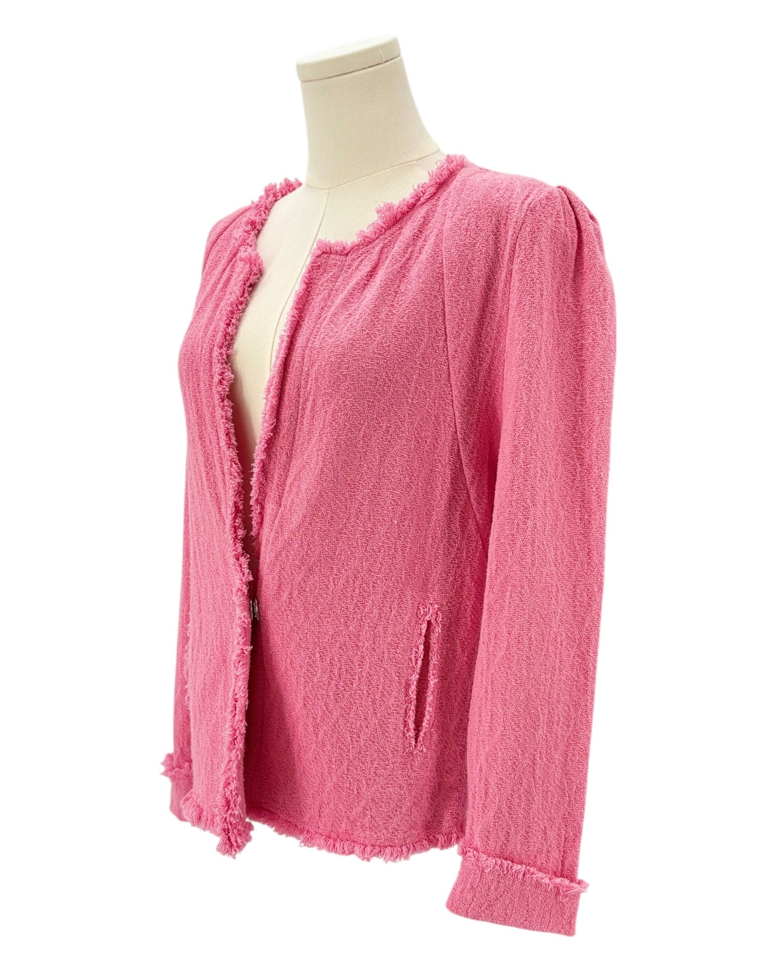 Pink textured jacket on a mannequin against a white background