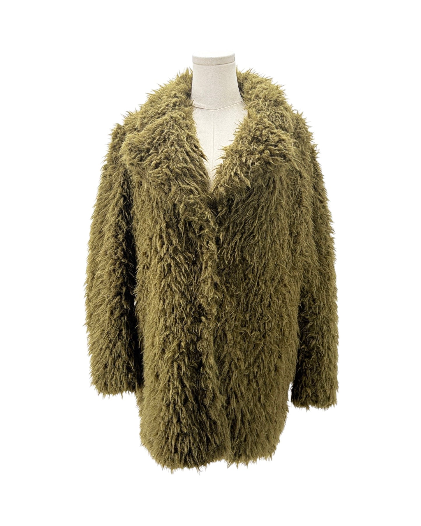Green fluffy cardigan on a mannequin against a white background