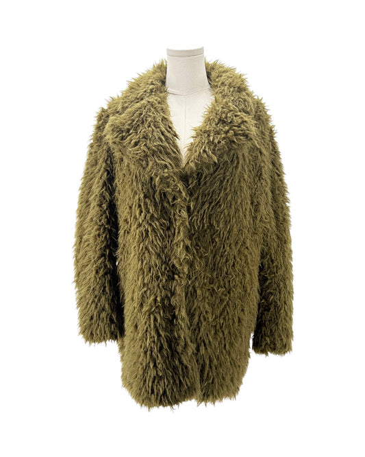 Green fluffy cardigan on a mannequin against a white background