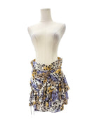 Mannequin wearing a patterned skirt on a white background