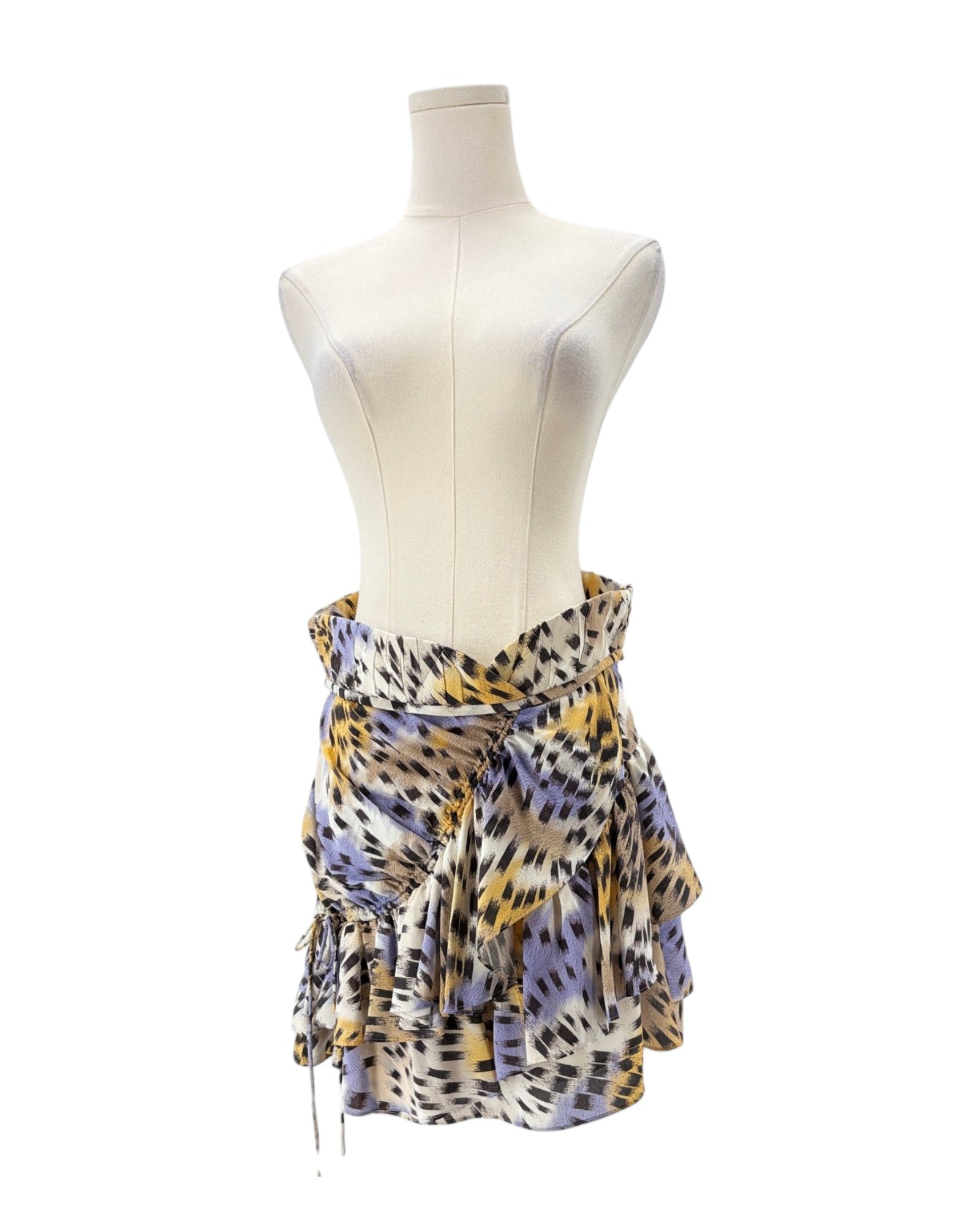 Mannequin wearing a patterned skirt on a white background