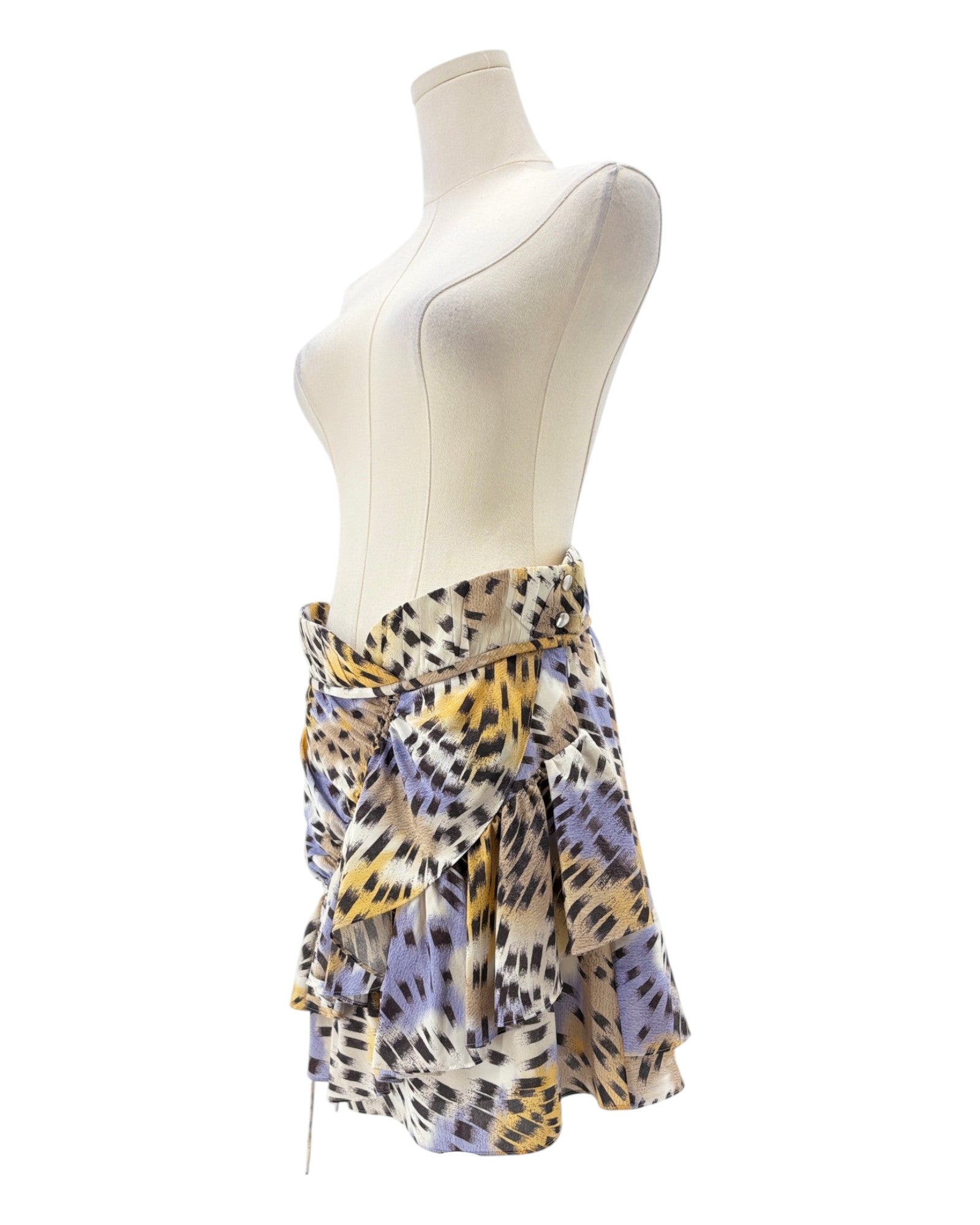 Mannequin wearing a colorful patterned skirt on a white background