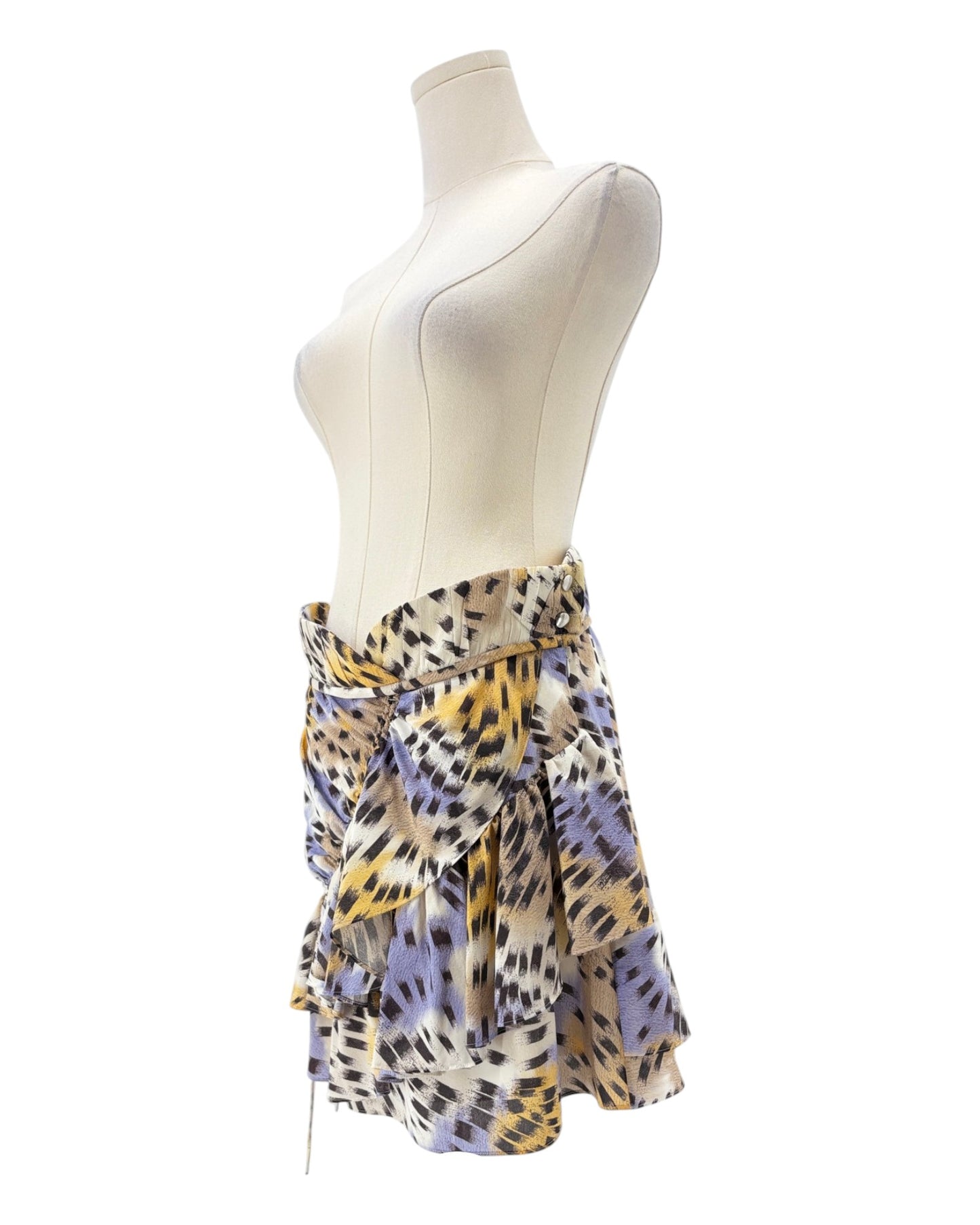 Mannequin wearing a colorful patterned skirt on a white background