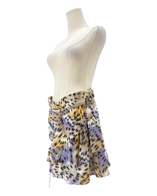 Mannequin wearing a colorful patterned skirt on a white background
