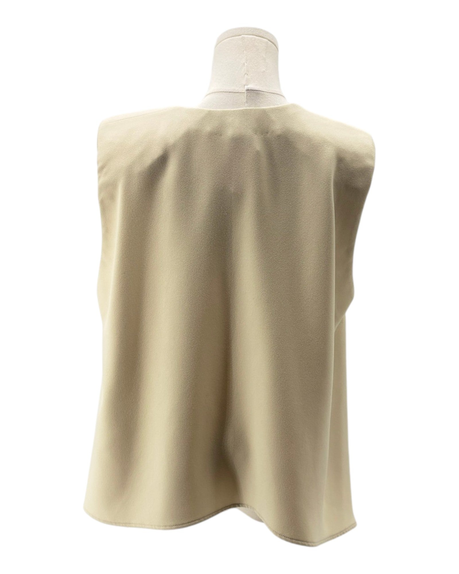 Beige sleeveless top on a mannequin against a white background