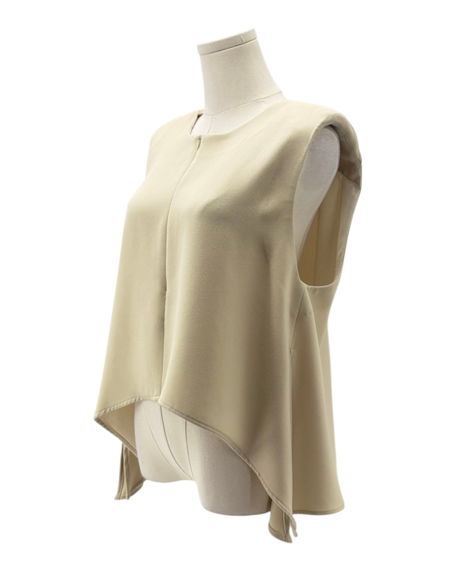 Beige sleeveless top on a mannequin against a white background
