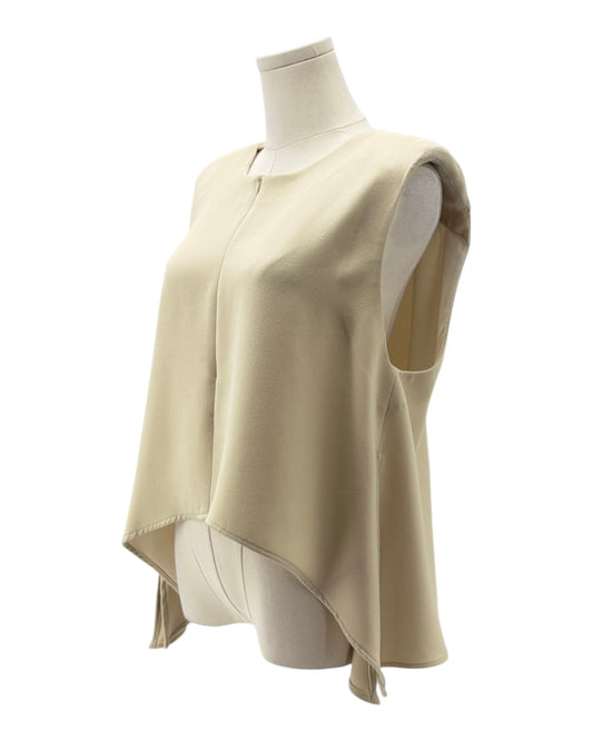 Beige sleeveless top on a mannequin against a white background