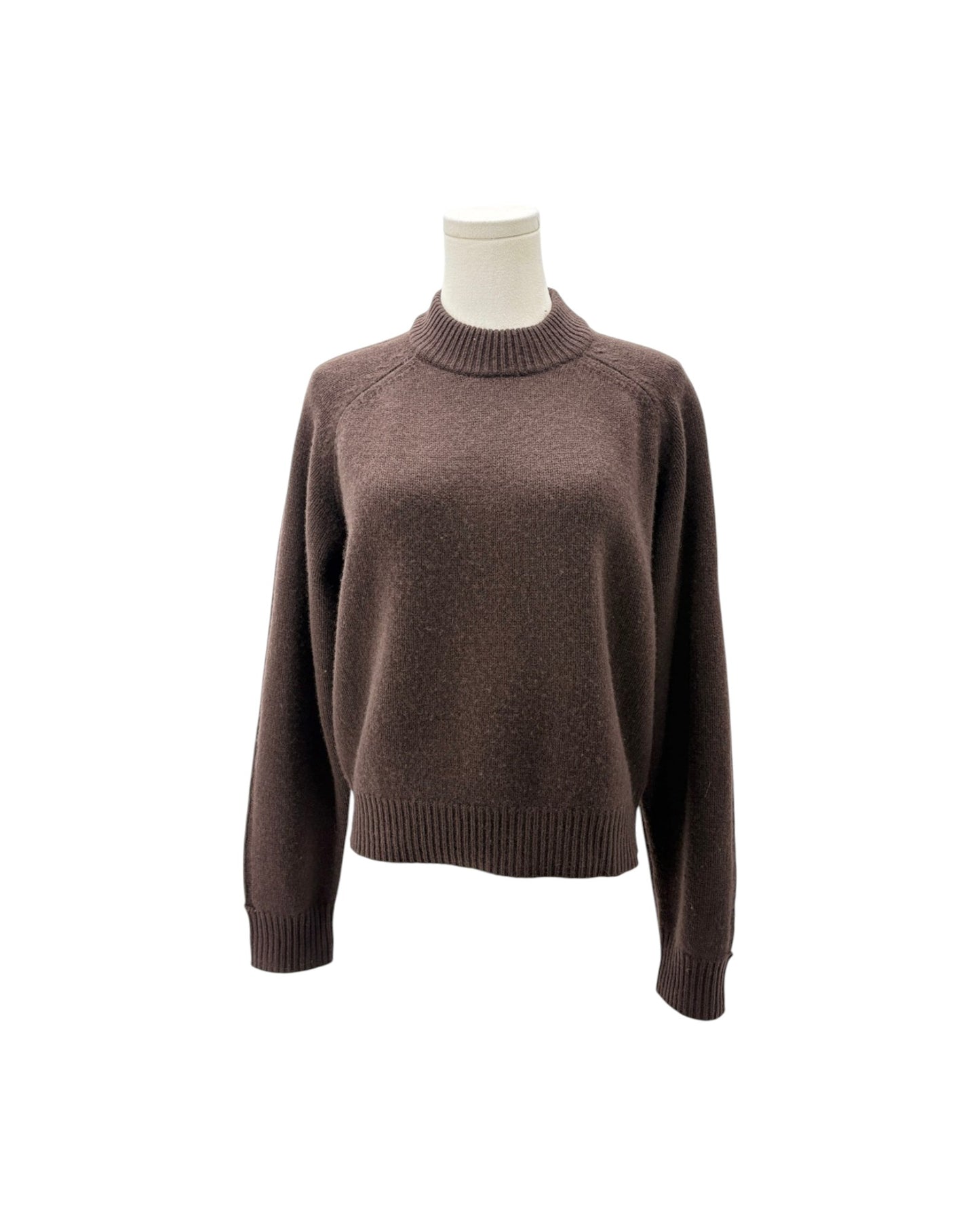 A dark brown knit sweater with a mock neck and raglan sleeves, displayed on a mannequin torso against a plain white background.