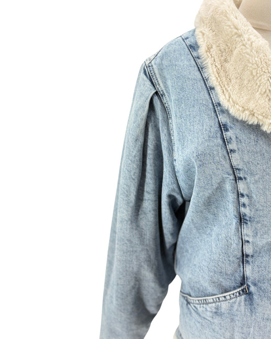 Light blue denim jacket with cream sherpa lining on a white background