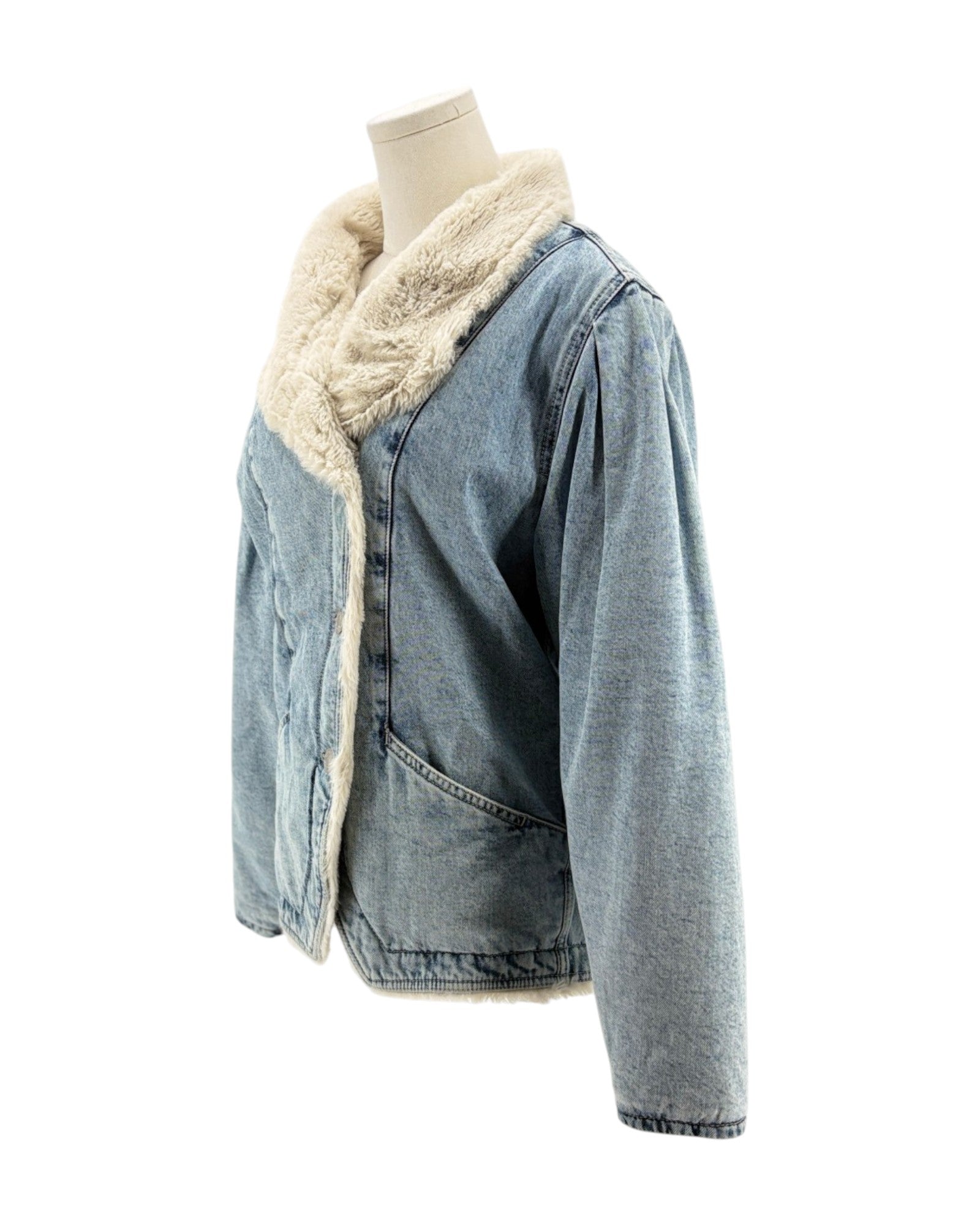 Denim jacket with cream sherpa lining on a mannequin against a white background