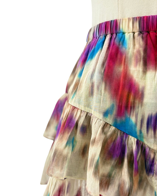 Colorful tiered skirt with abstract pattern on a white background