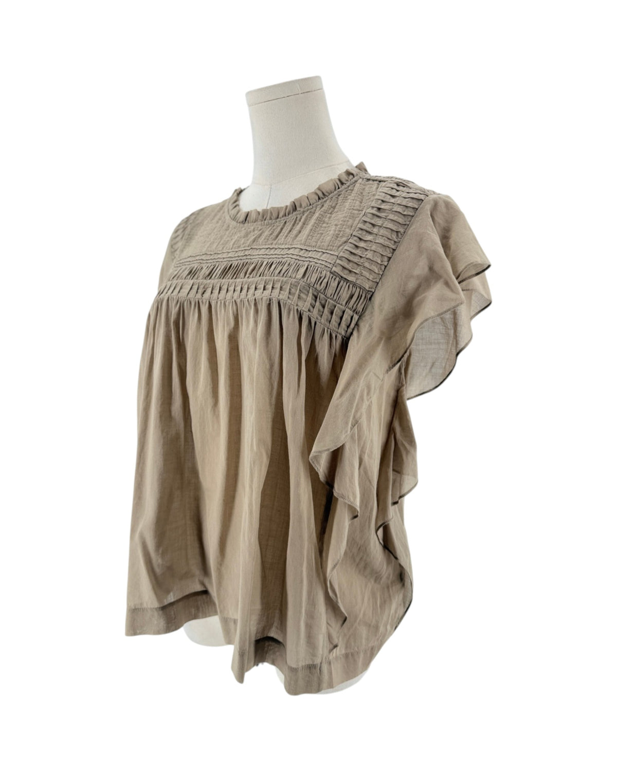 Beige short sleeve top with smocked yoke bodice, ruffled crewneck, tiered bohemian flutter sleeves on a mannequin on a white background