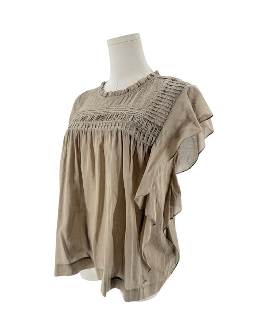Beige short sleeve top with smocked yoke bodice, ruffled crewneck, tiered bohemian flutter sleeves on a mannequin on a white background
