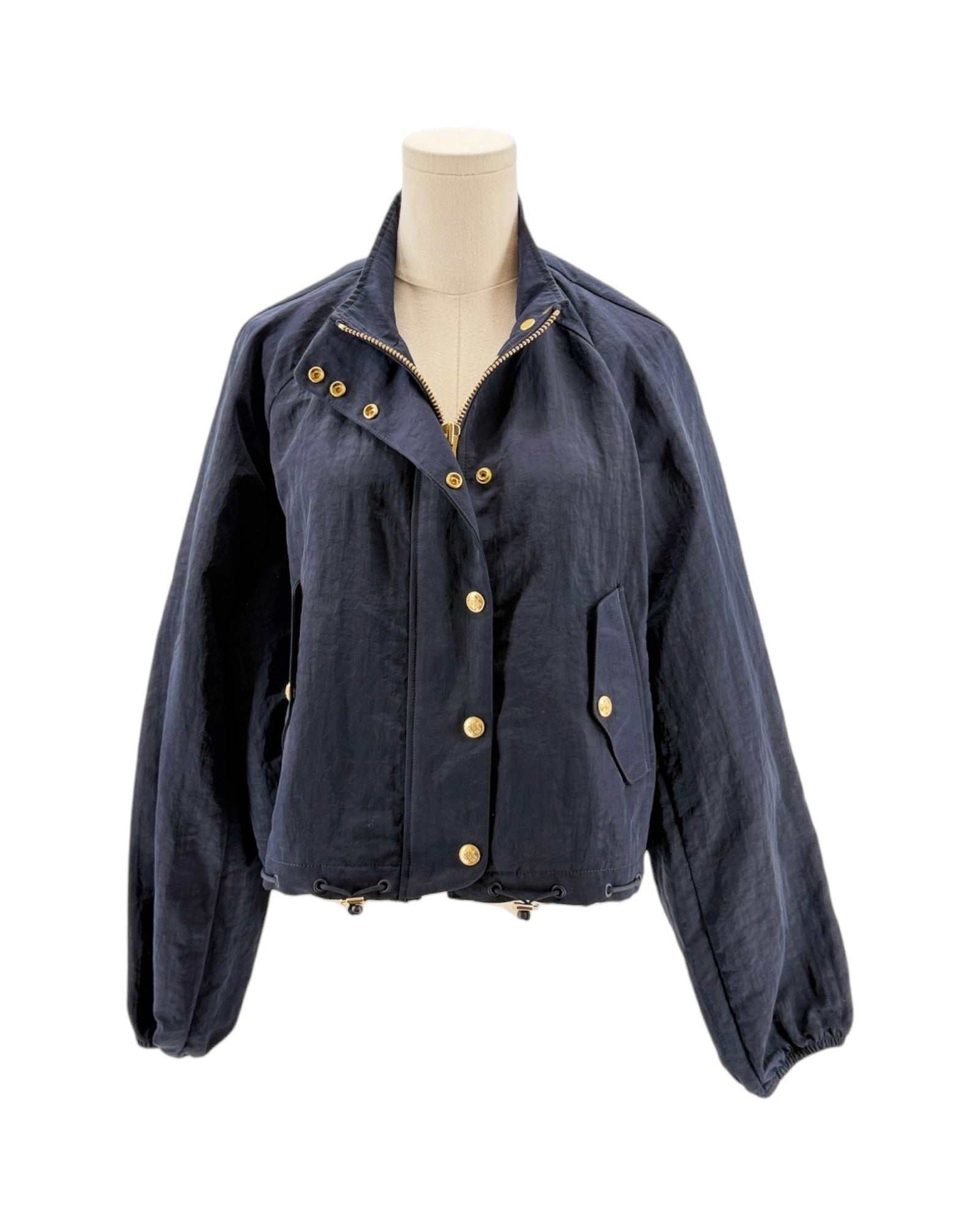 Navy blue jacket with gold buttons on a mannequin against a white background