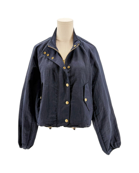 Navy blue jacket with gold buttons on a mannequin against a white background