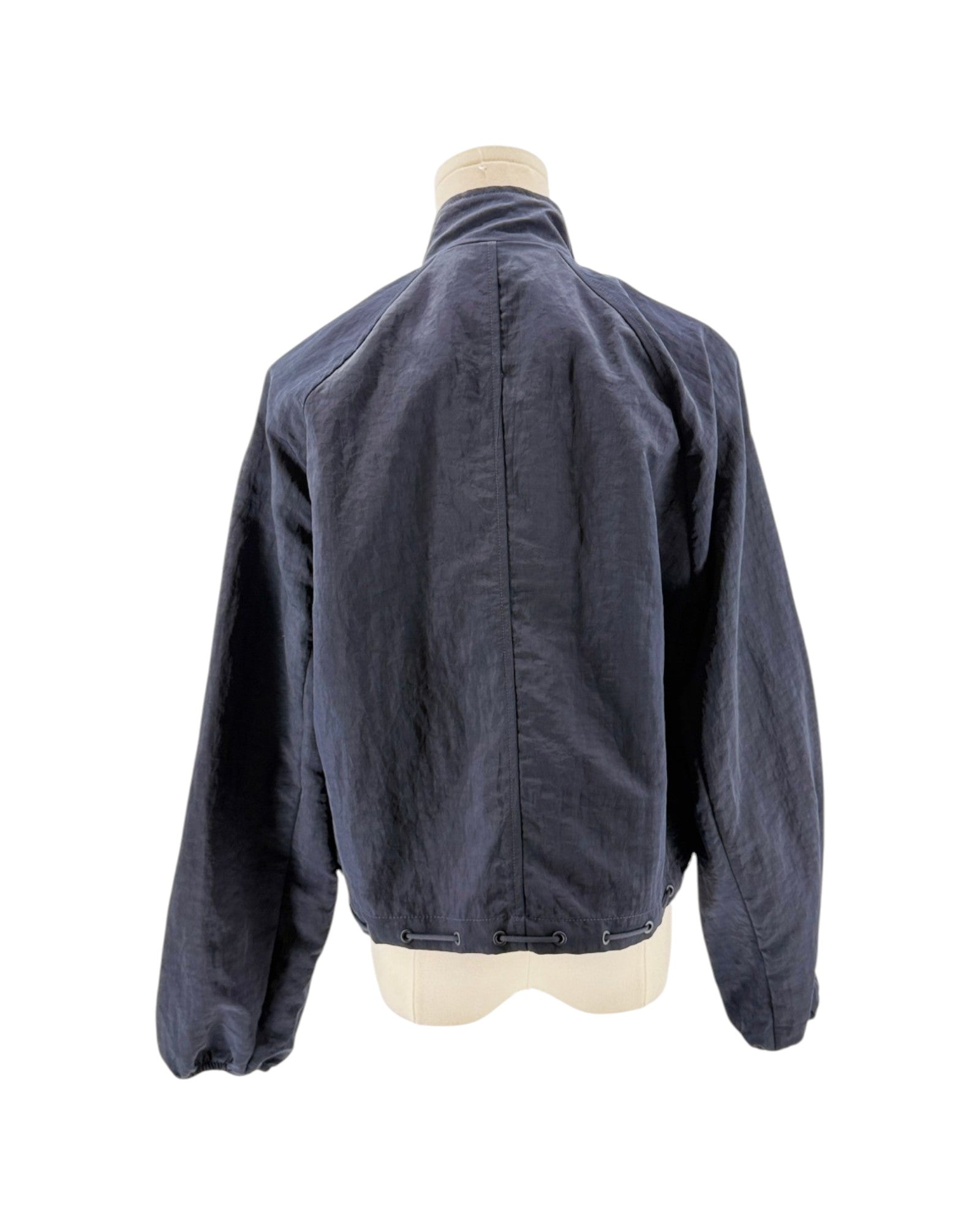 Blue jacket on a mannequin against a white background