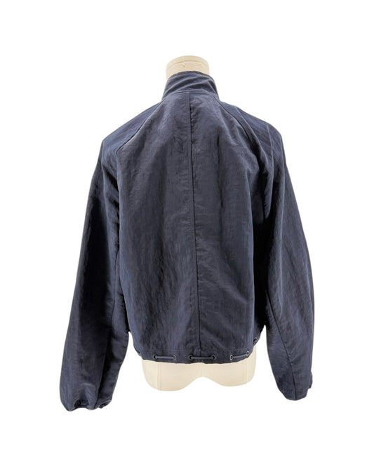 Blue jacket on a mannequin against a white background