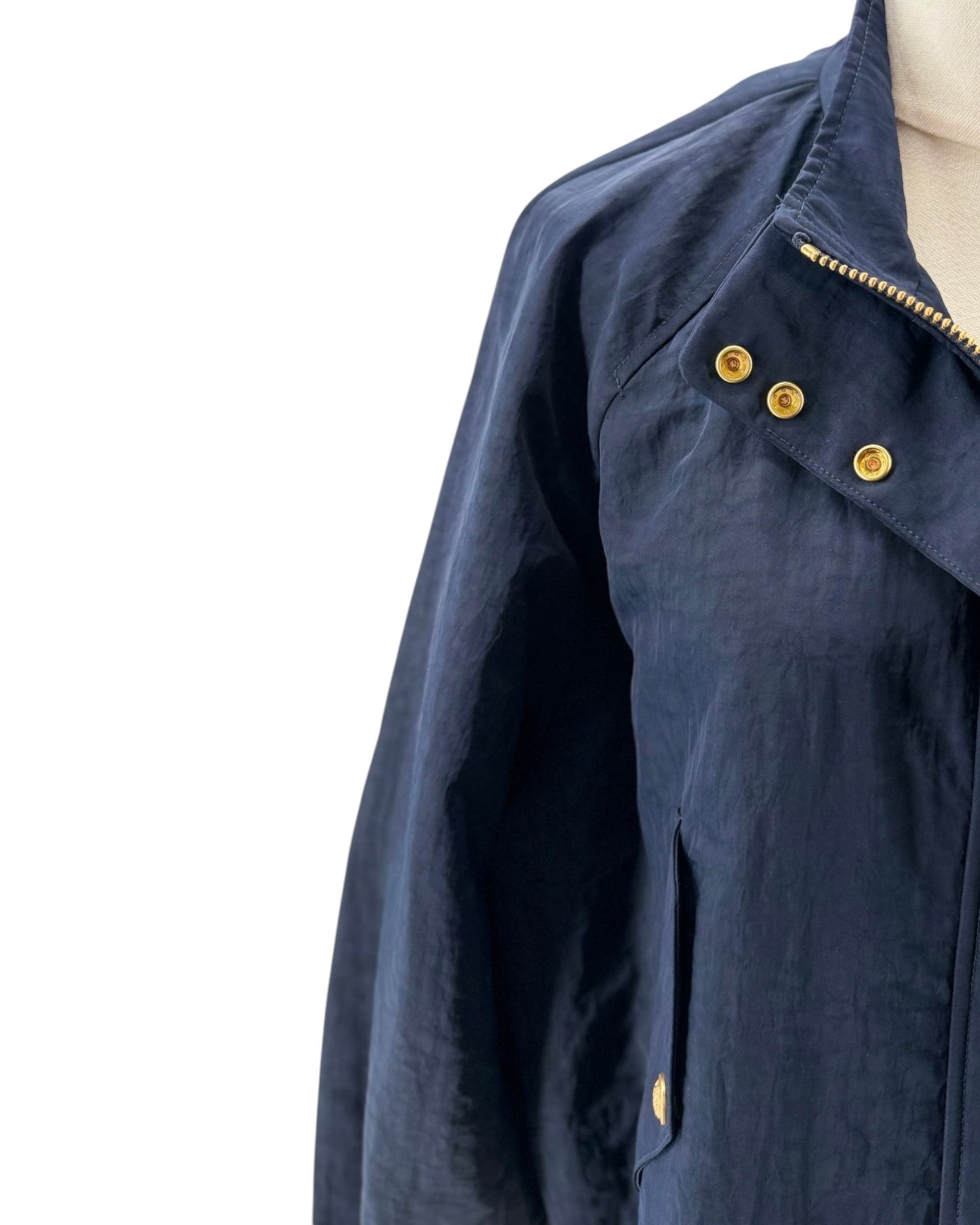 Navy blue jacket with gold buttons on a white background