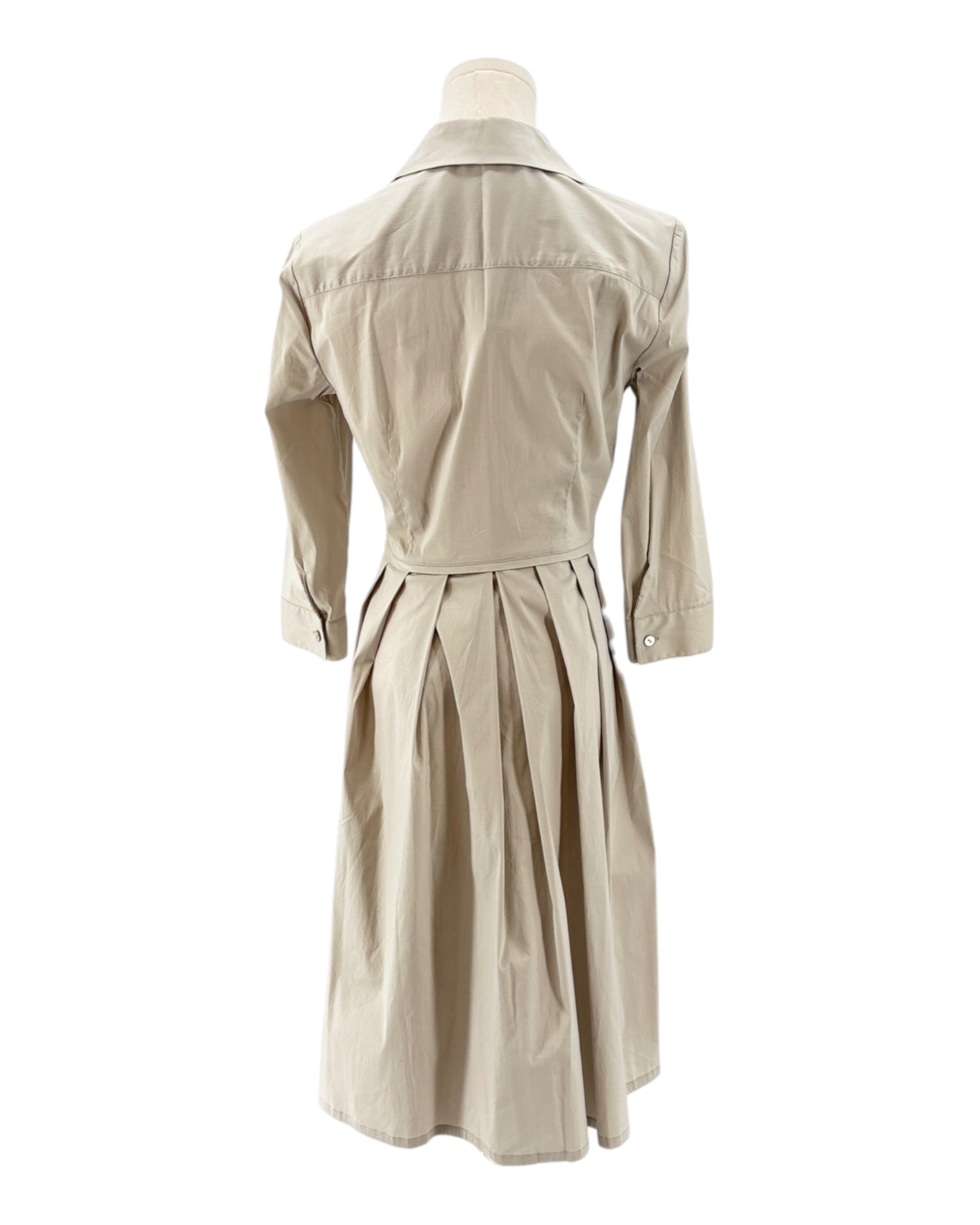 Beige long sleeve dress on a mannequin against a white background