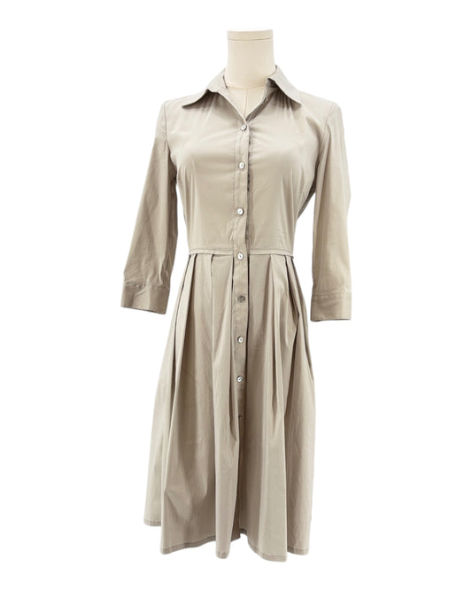 Beige dress on a mannequin against a white background