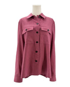 Pink shirt on a mannequin against a white background