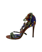 Multicolored high-heeled sandal on a white background