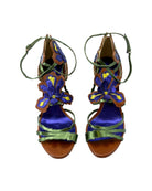Pair of colorful sandals with floral designs on a white background