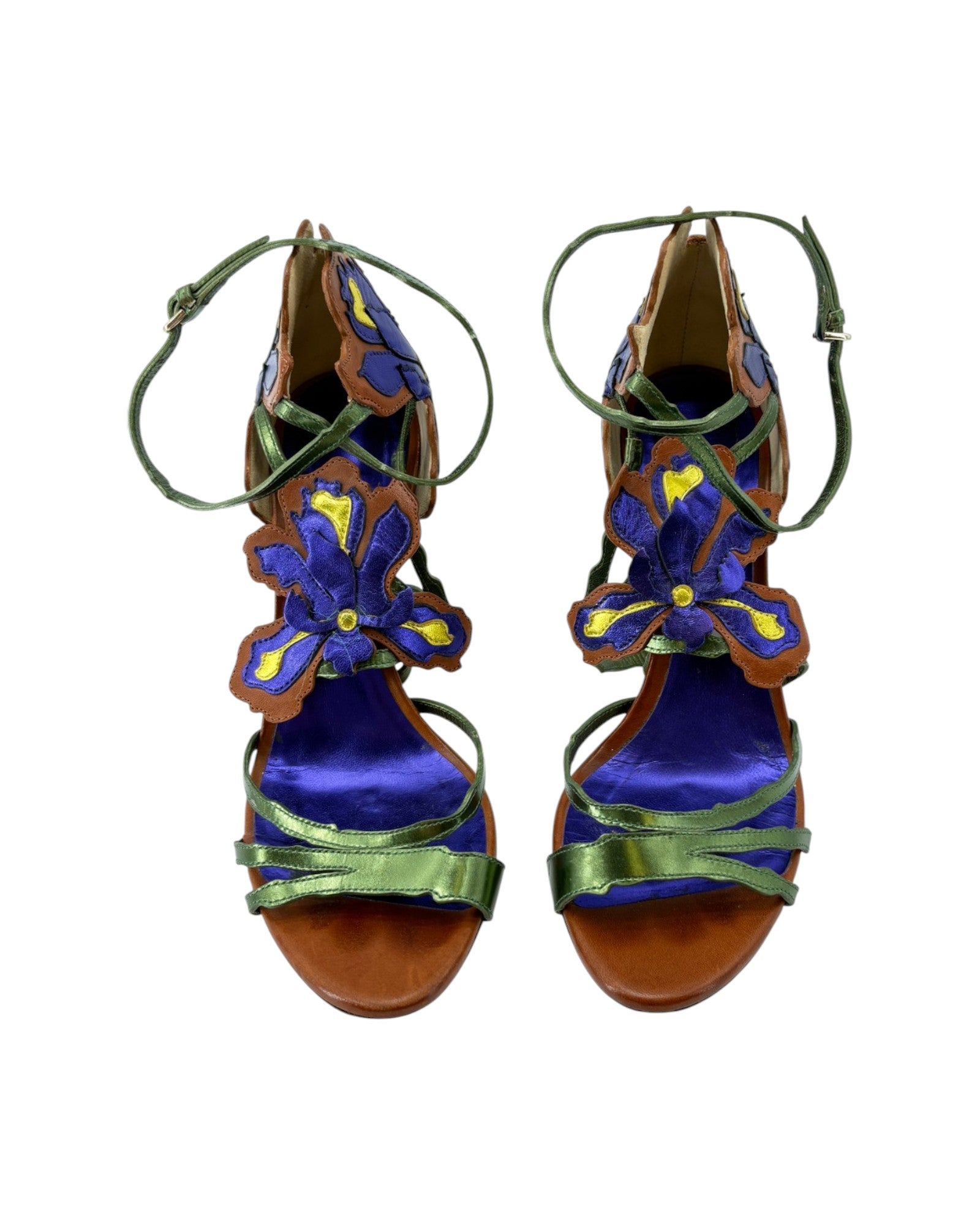 Pair of colorful sandals with floral designs on a white background