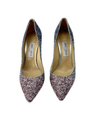 Pair of Jimmy Choo glittery high heels on a white background