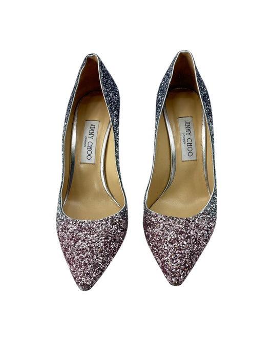 Pair of Jimmy Choo glittery high heels on a white background